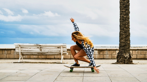 A young woman skateboarding